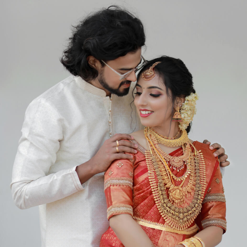 Cinematic wedding film still — couple during ceremony captured by 7Ads Wedding Company, Kayamkulam, Kerala